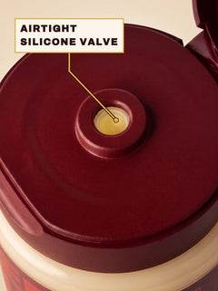 Flip-top cap open with a callout pointing to the airtight silicone valve